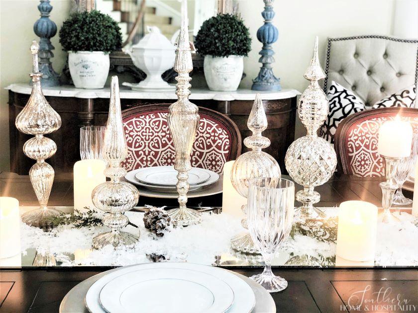 Mercury glass finials in dining table centerpiece