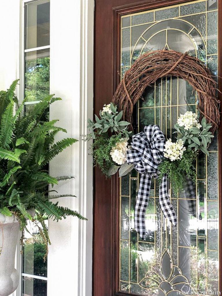 Grapevine wreath with hydrangeas and gingham bow