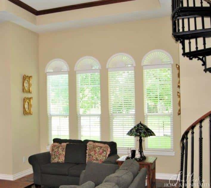 Family room before renovation with arch windows