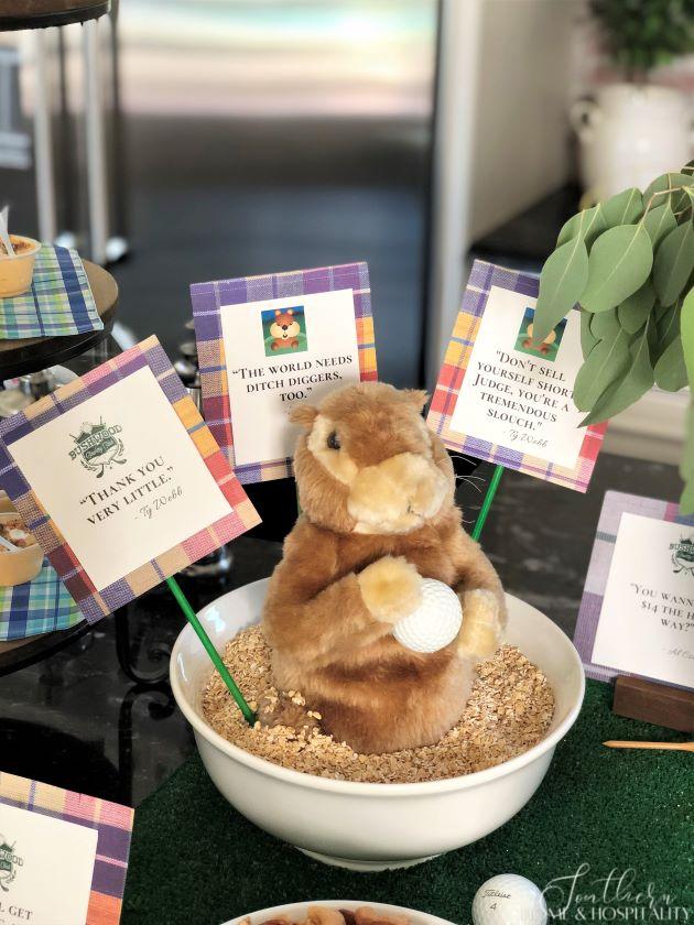 Golf theme party food with gopher in bowl and movie quote signs