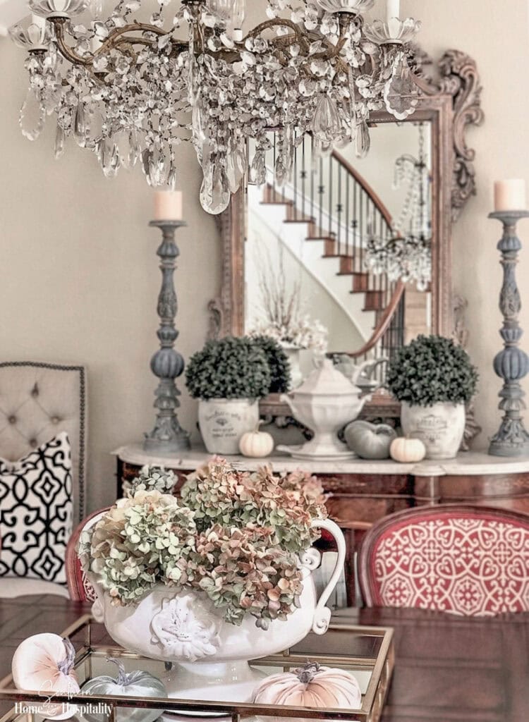 Dried hydrangeas in an urn in a French style dining room