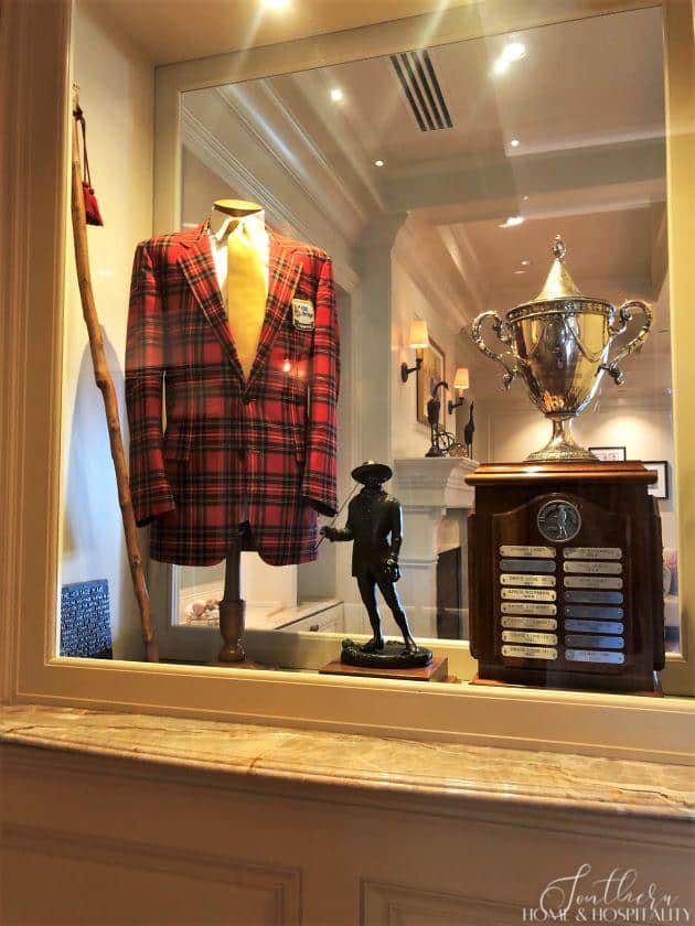 Harbour Town clubhouse display case with plaid jacket and trophy