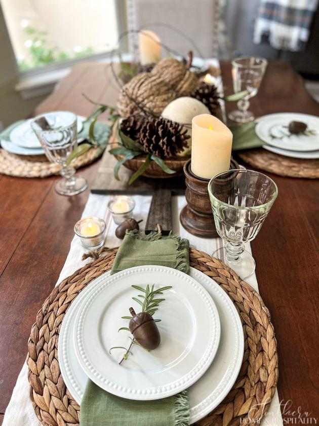 casual fall place setting with acorn, rosemary, white plates