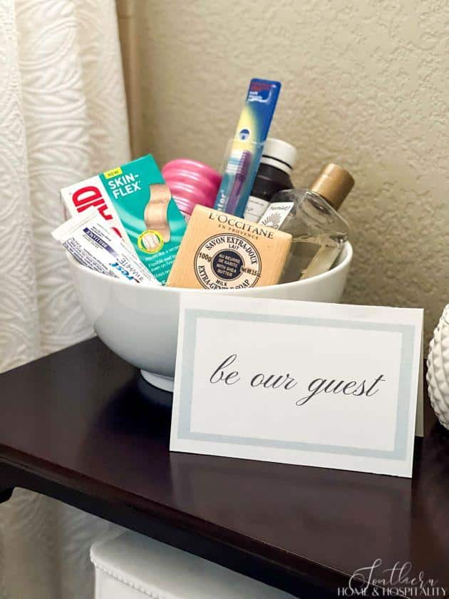 bowl of extra toiletries and be our guest sign