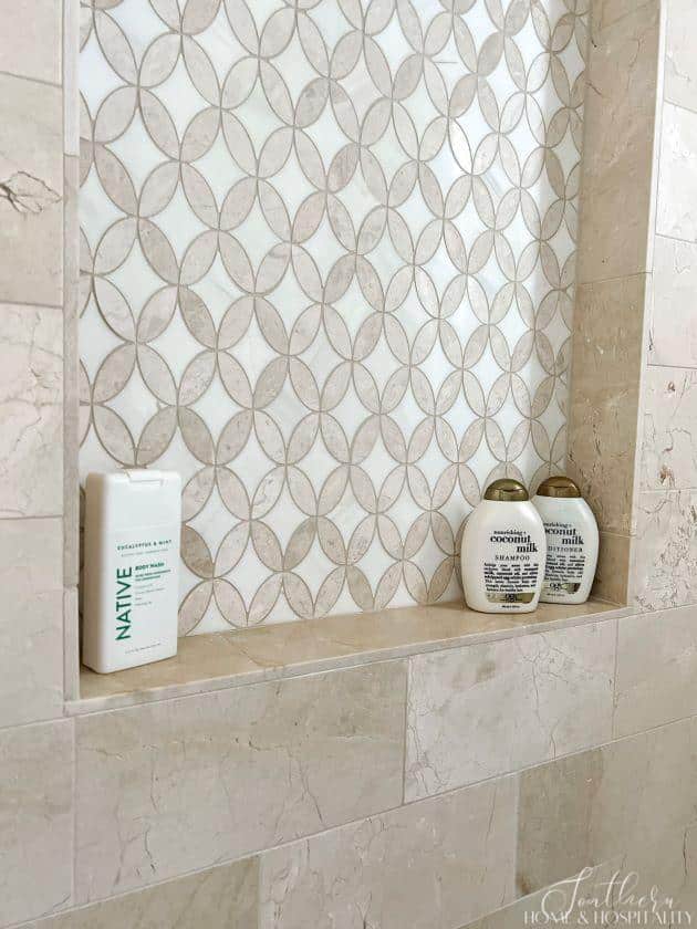 Shampoo, conditioner, and body wash in shower for guests