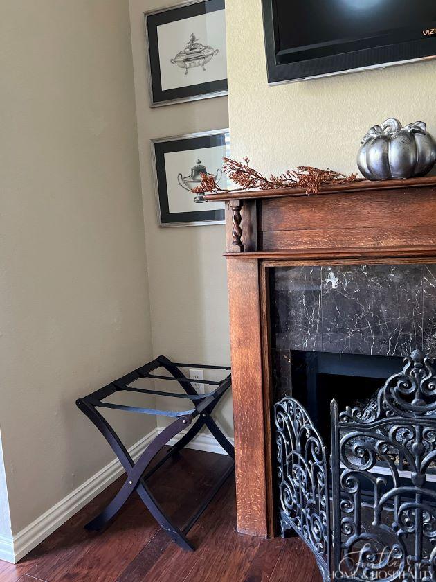 luggage rack by fireplace for guests