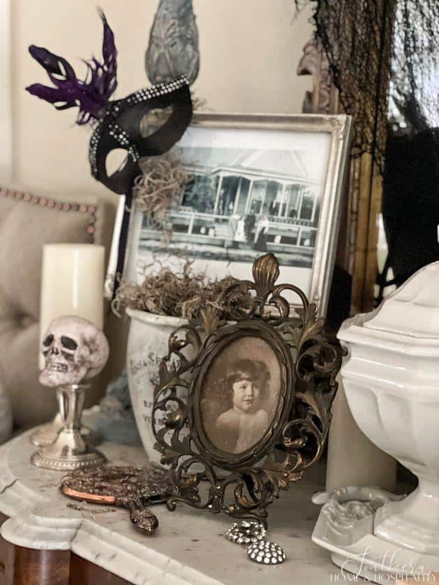 Halloween vignette with old photos and skulls