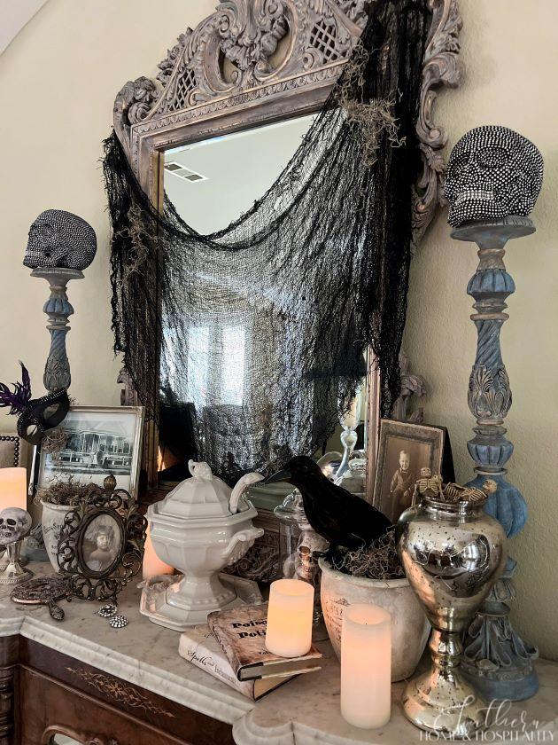 spooky chic gothic halloween dining room sideboard vintage photographs