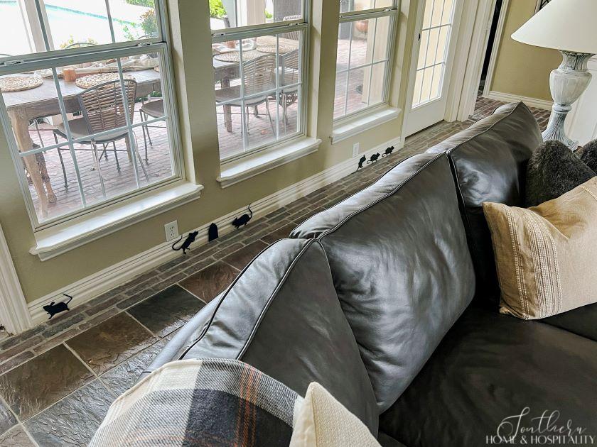 Rat shadow decorations on baseboard