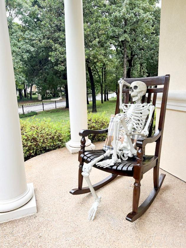 skeleton in rocking chair on porch