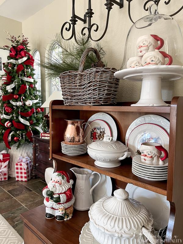 vintage santa mugs, ironstone on hutch, red and white Christmas tree