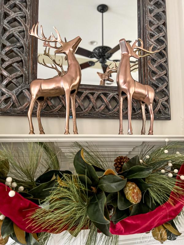 magnolia and pine Christmas garland, red ribbon on Christmas garland, copper deer