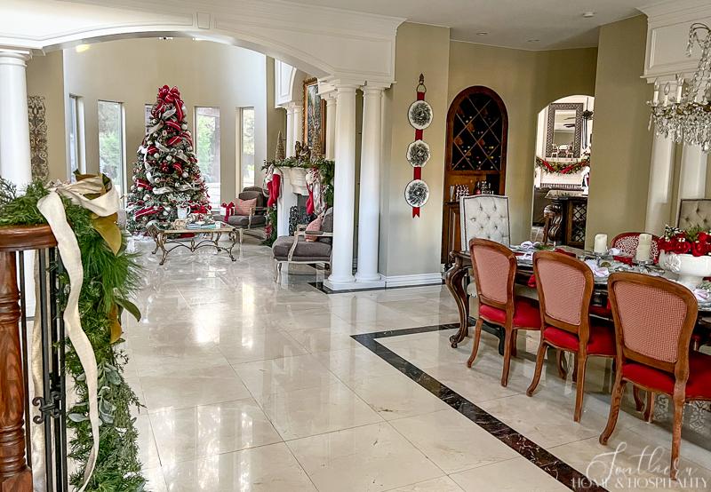 traditional dining room and living room decorated for Christmas in red and white
