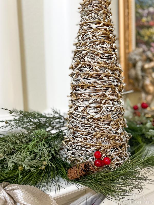 gold and white grapevine Christmas cone tree with greenery