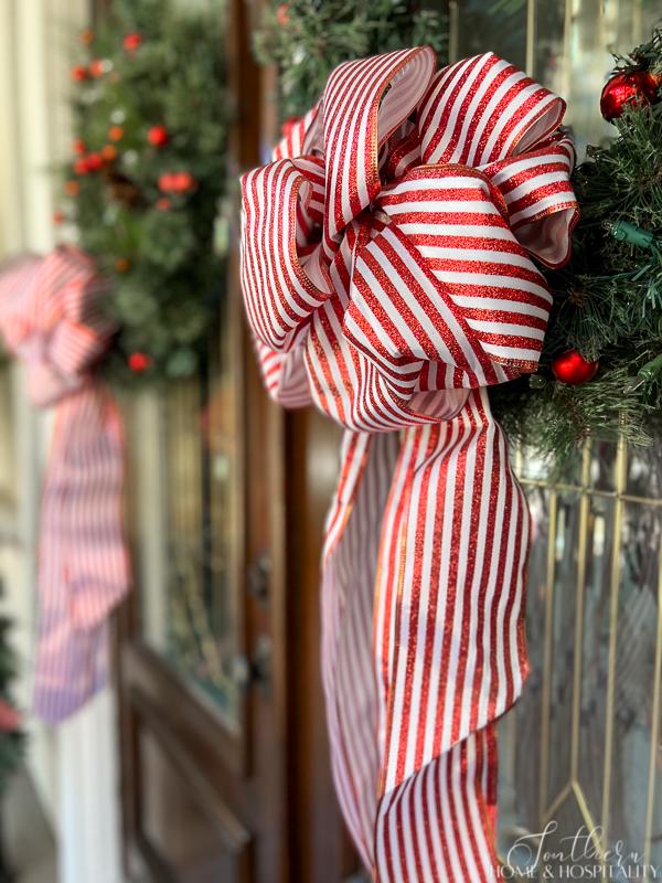 red and white stripe bow on Christmas wreath
