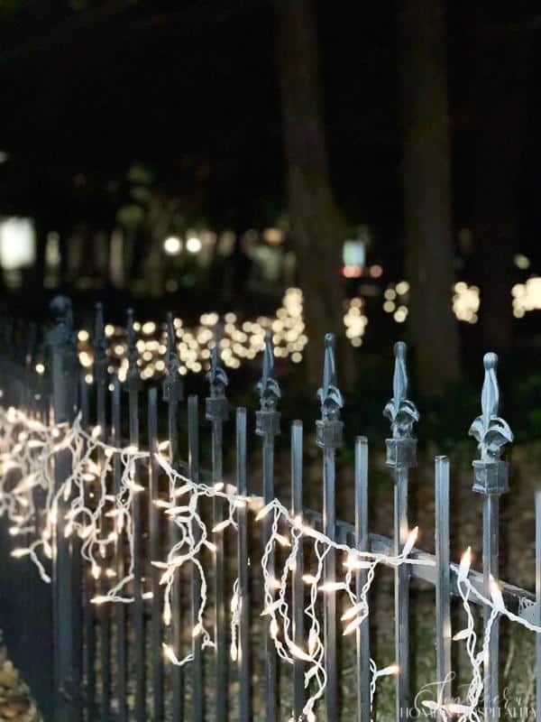 icicle lights on iron fence