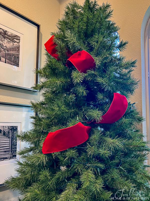 Red ribbon on Christmas tree