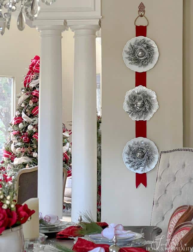 triple wreaths on white plates Christmas wall hanging