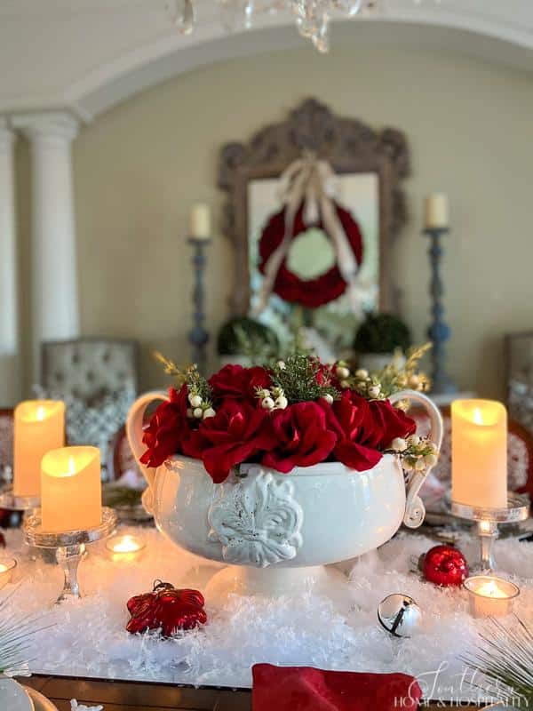 White bowl with red roses centerpiece