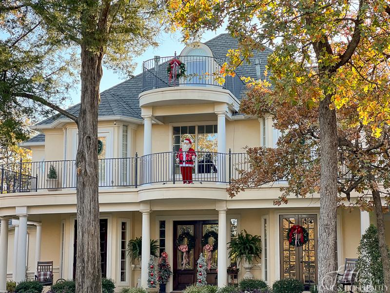 southern house front decorated for Christmas, Santa on balcony