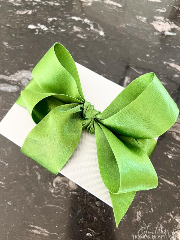 Gift with a green satin four loop bow
