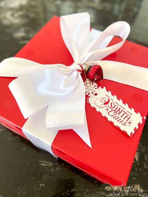 red gift with white bow