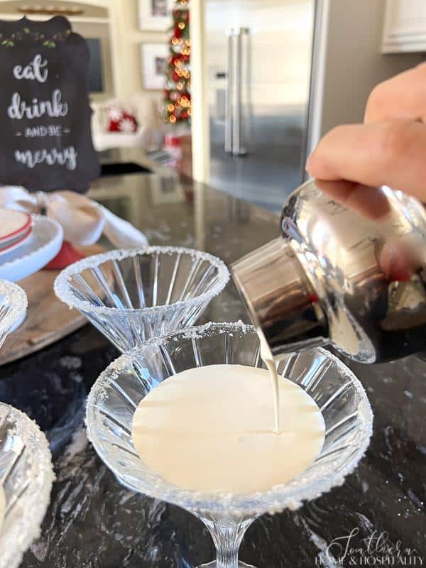 pouring White Christmas martini