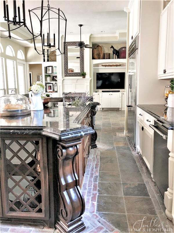Kitchen with furniture island, black titanium granite, open concept kitchen and family room