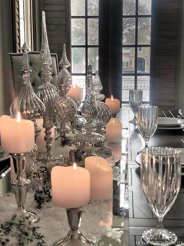 Mercury glass and candles in a winter table centerpiece