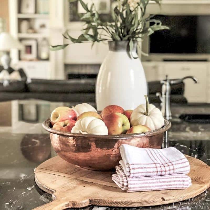 French country fall decorating with apples and pumpkins in copper bowl