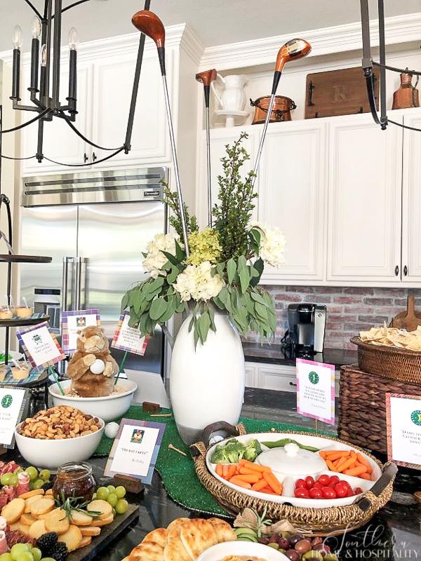 Golf themed party centerpiece with golf clubs