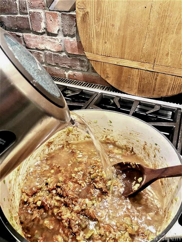 Mixing water into roux and vegetables