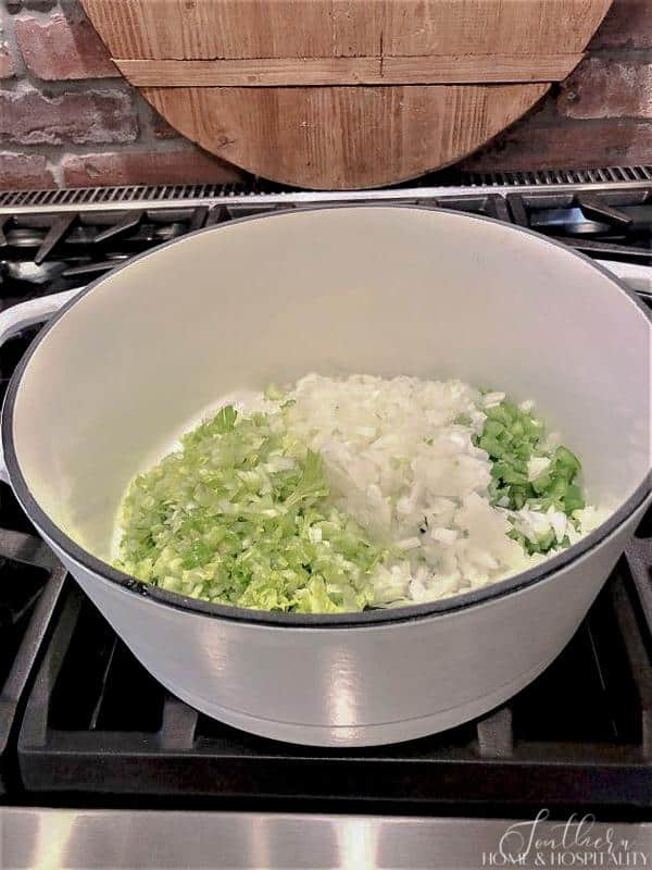 The trinity of chopped celery, onion, bell pepper in a pot