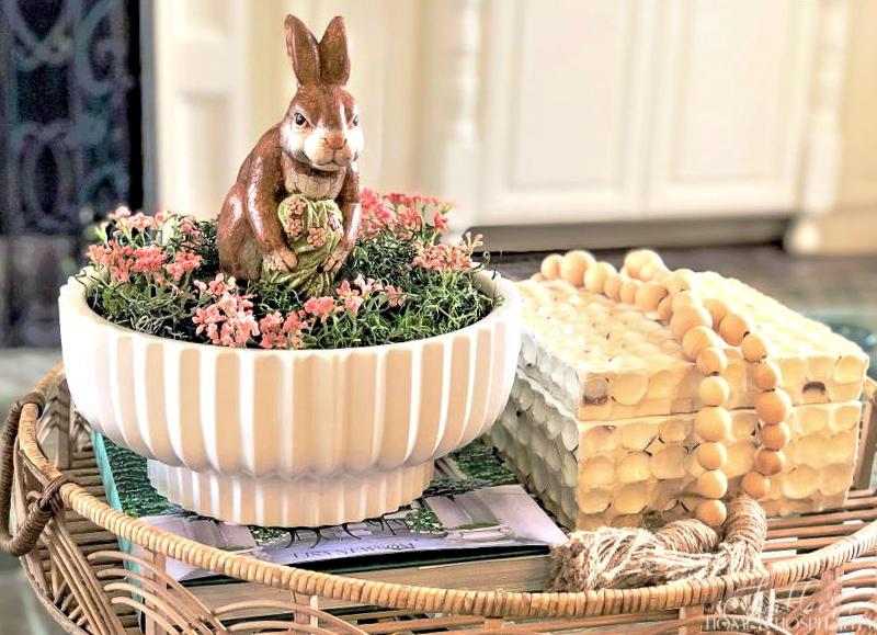 spring coffee table decor with bunny and flowers in a bowl