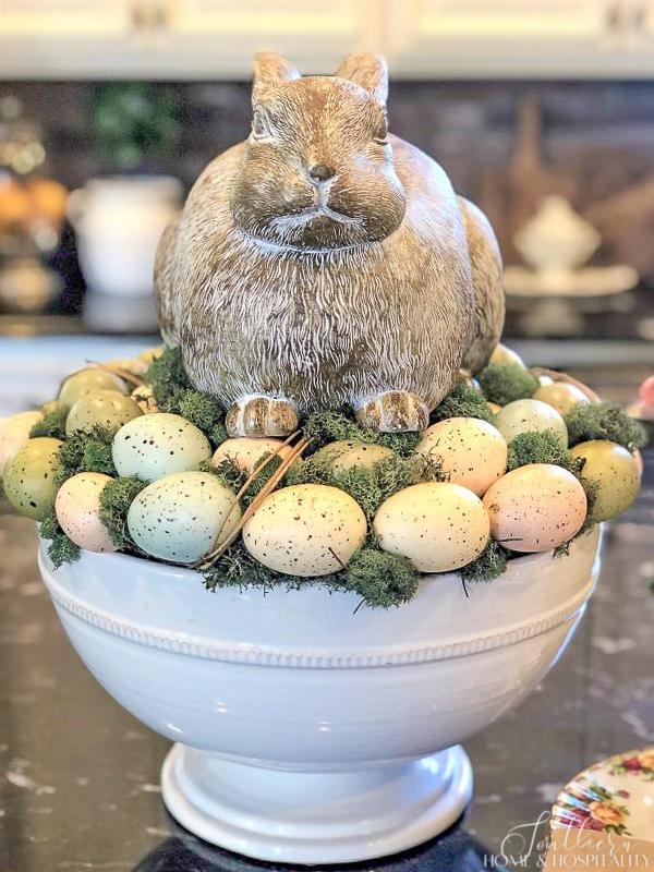 spring decorating centerpiece with bunny and eggs in a bowl