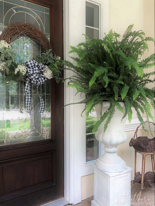 Summer decorating  with grapevine front door wreaths and ferns