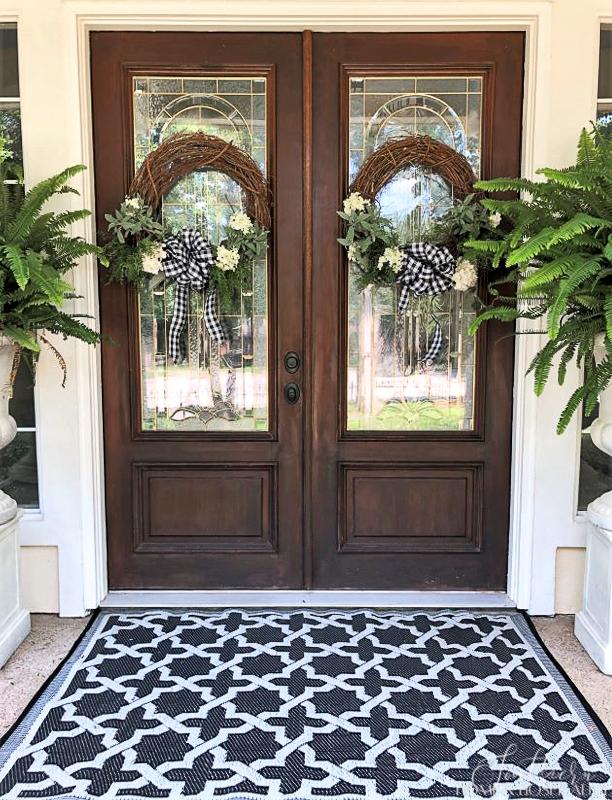 Summer decorating  with grapevine front door wreaths and ferns
