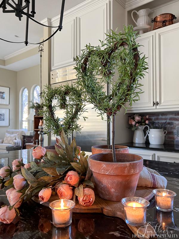 Valentine's day kitchen decor with heart shaped rosemary topiaries