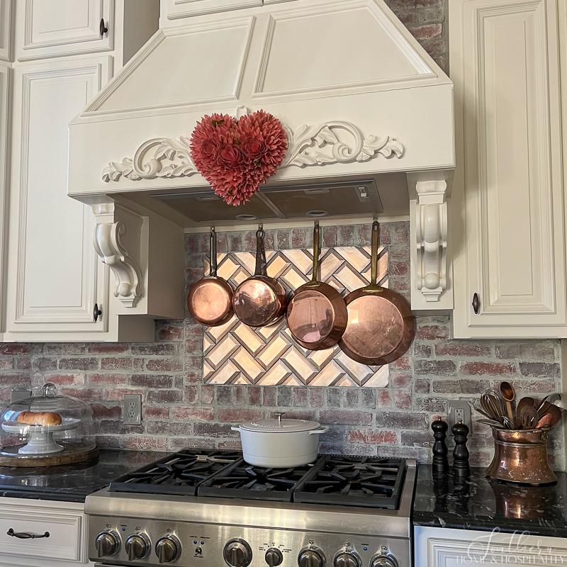 French country kitchen Valentine's day decorations with heart on vent hood