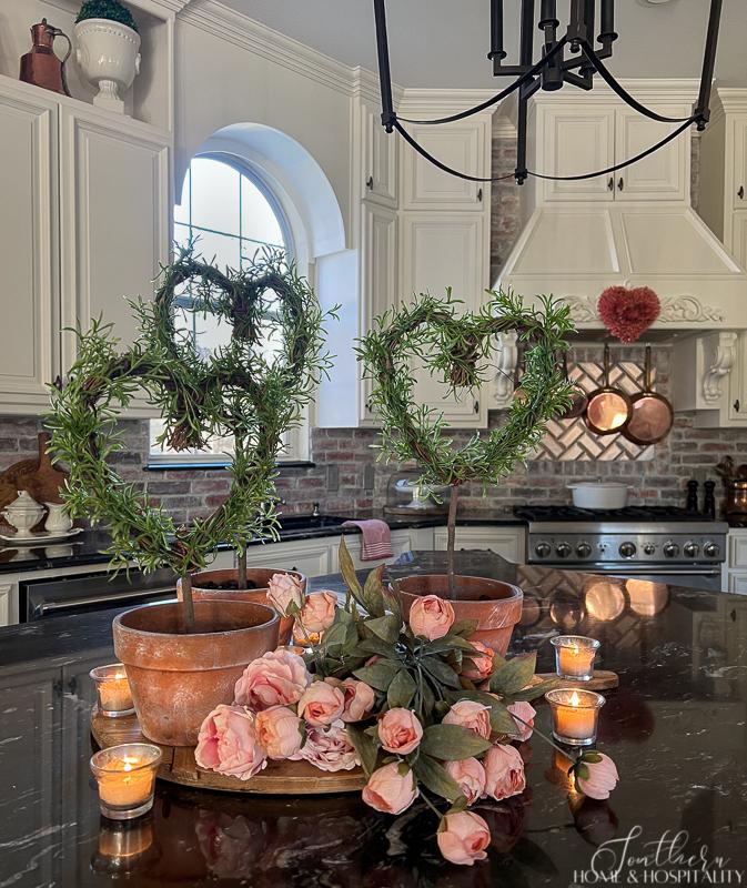 Heart shaped rosemary topiaries in a French country kitchen