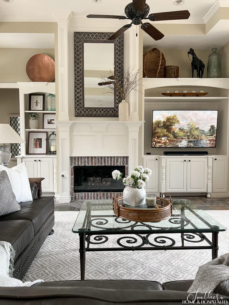 Traditional Family room painted wood and brick fireplace mantel and built ins