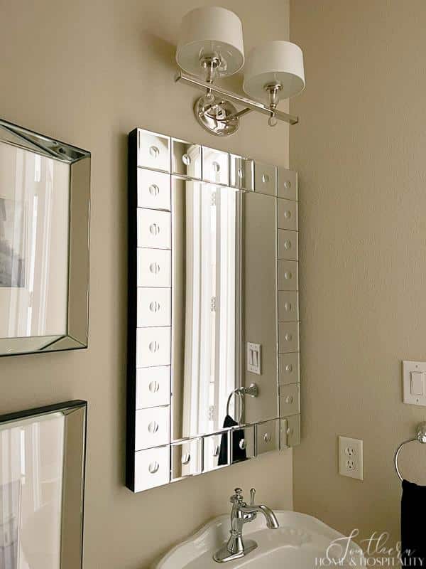 decorative vanity mirror in powder room