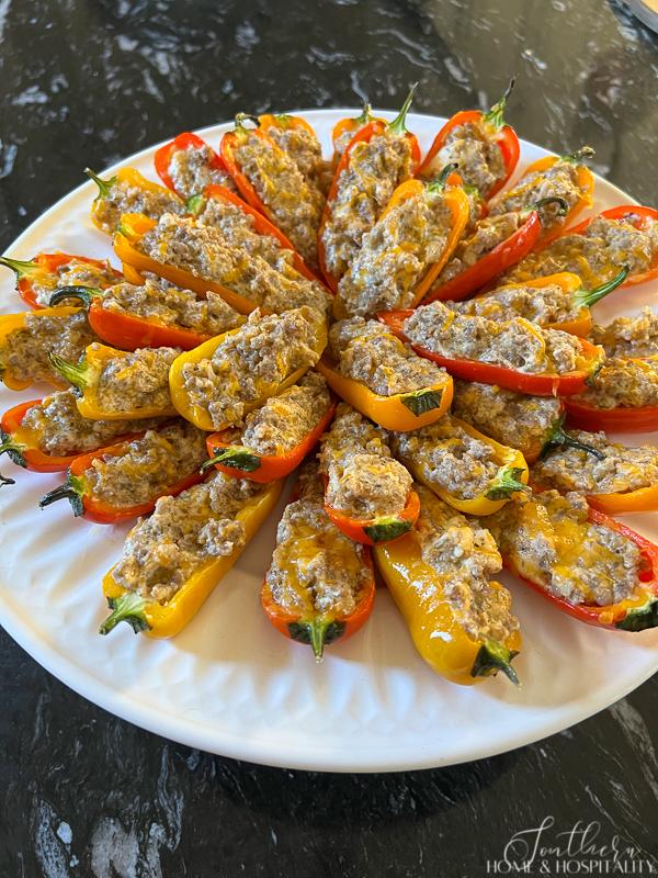 Sausage Stuffed Sweet Mini Peppers on round plate