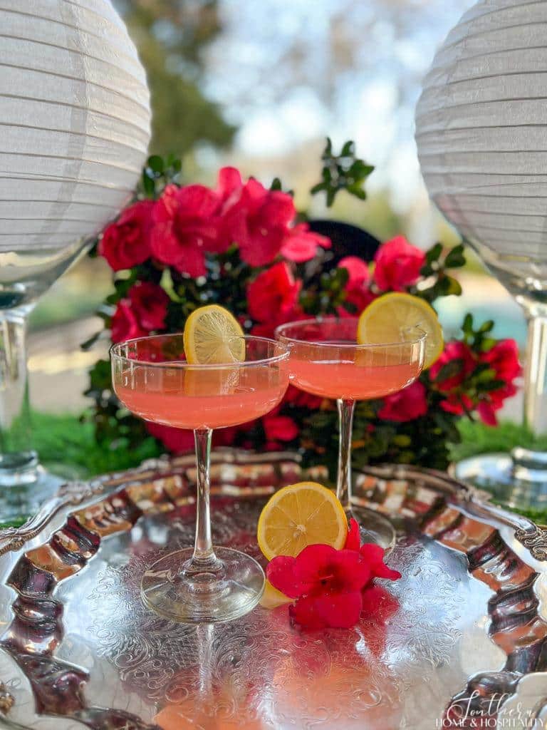 Pink Azalea martinis served in coupe glasses on a silver tray