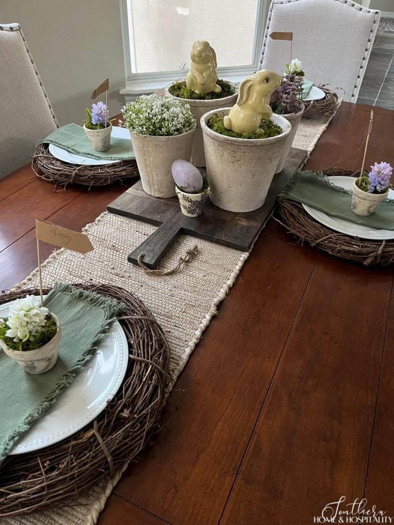Casual French country Easter table with vintage garden pots