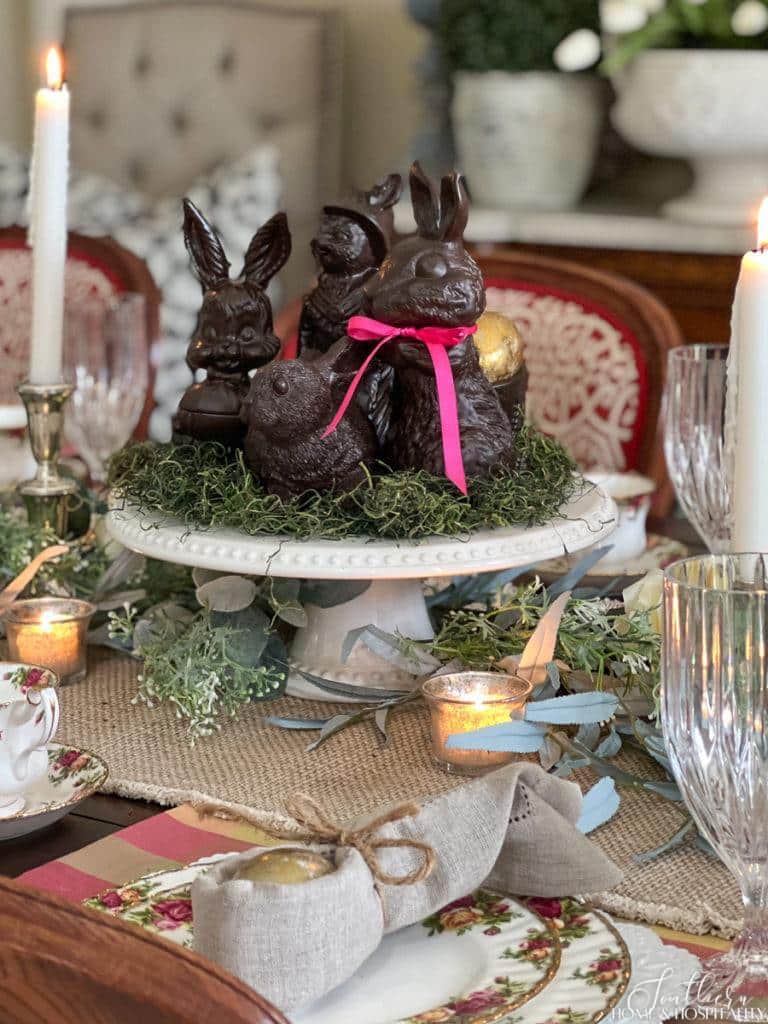 Faux chocolate bunnies in a spring table centerpiece