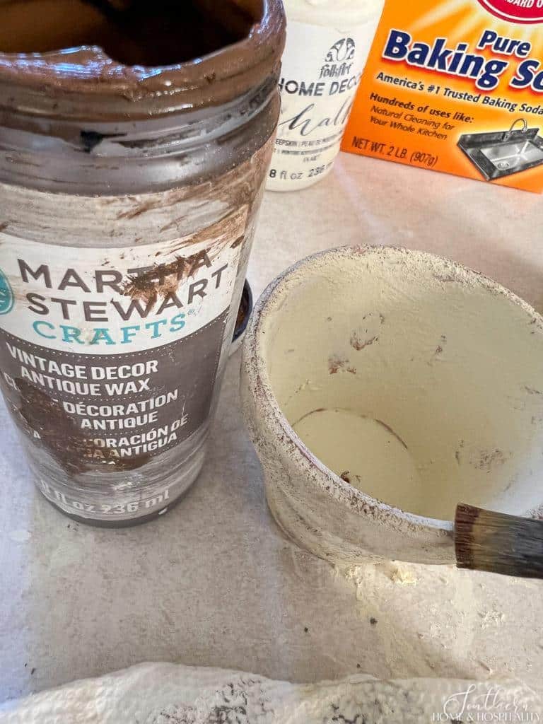 Dry brushing antique wax onto flower pot