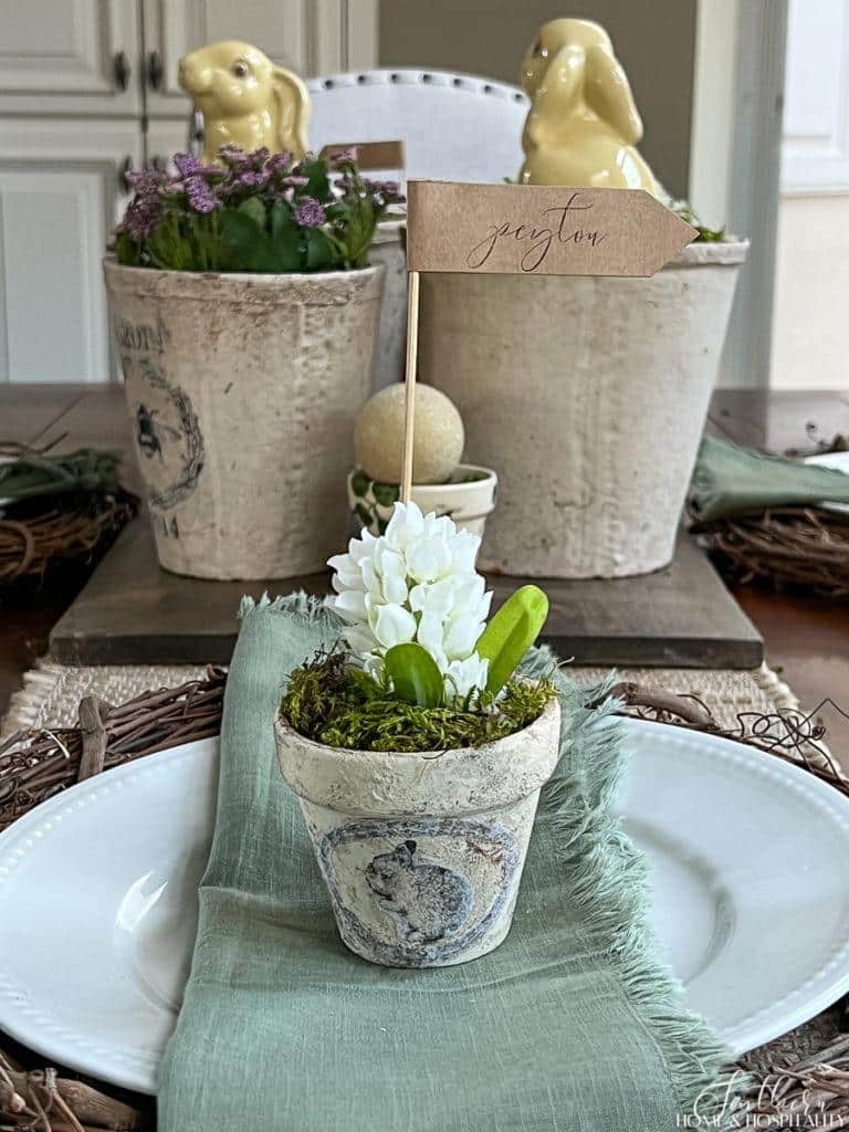 Vintage flower pot with bunny graphic with a name card