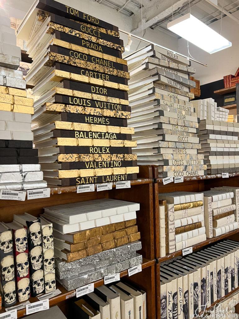 Decorative books with designer names on the spines