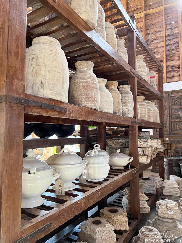 Rustic pottery vases and ironstone tureens on a shelf at Old World Antieks